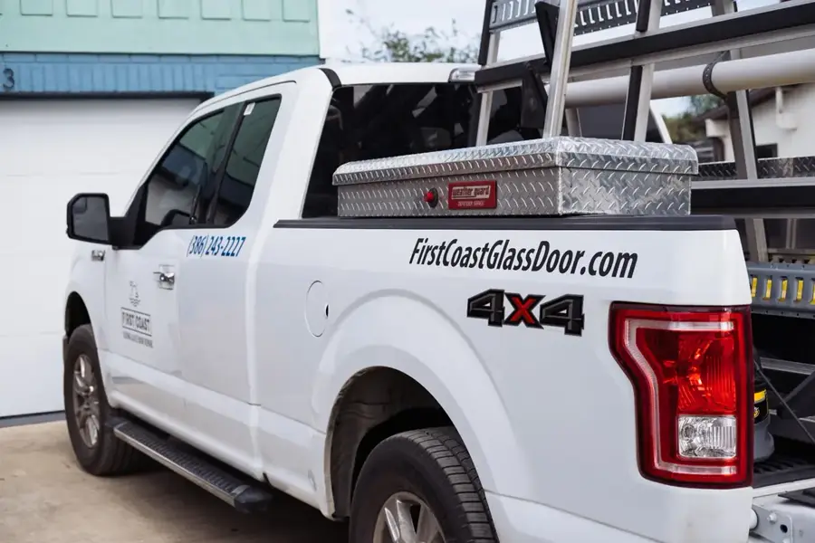 Side view of the branded First Coast Sliding Glass Door Repair service truck